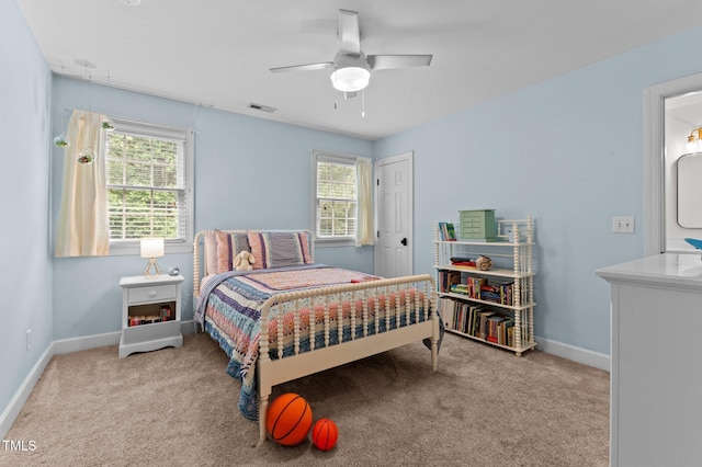1332 Kinsdale Dr, Raleigh, NC 27615 - bedroom with carpet floors, multiple windows, and baseboards