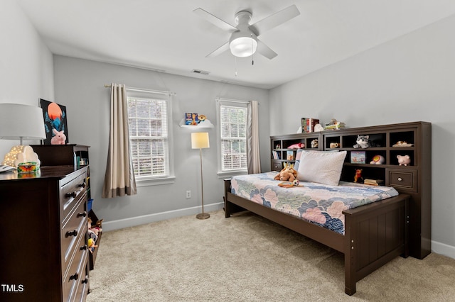 1332 Kinsdale Dr, Raleigh, NC 27615 - carpeted bedroom with baseboards and a ceiling fan