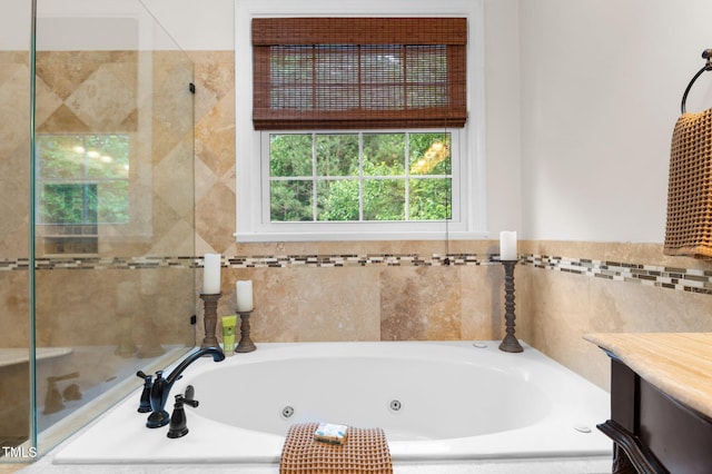 1332 Kinsdale Dr, Raleigh, NC 27615 - bathroom with a tub with jets, vanity, and tiled shower
