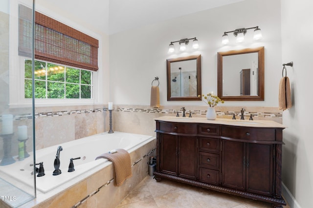 1332 Kinsdale Dr, Raleigh, NC 27615 - bathroom featuring double vanity, a garden tub, and tile patterned floors