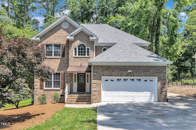 5121 Ten Point Trl, Wake Forest, NC 27587 - traditional-style house featuring concrete driveway, roof with shingles, brick siding, and an attached garage