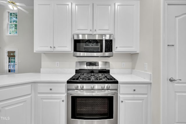 5121 Ten Point Trl, Wake Forest, NC 27587 - kitchen with stainless steel appliances, white cabinetry, and light countertops