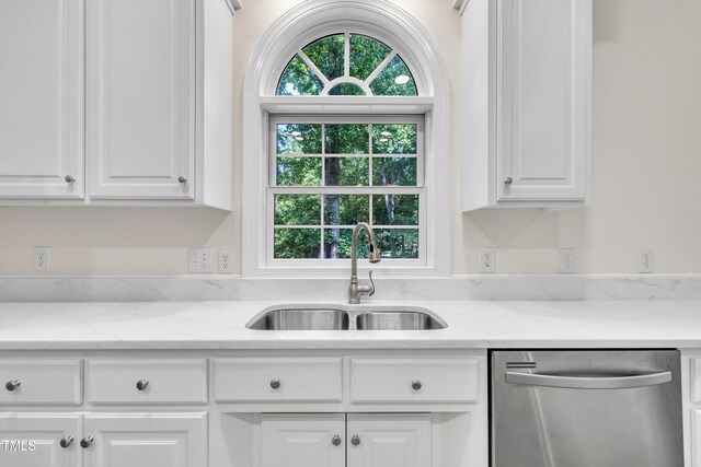 5121 Ten Point Trl, Wake Forest, NC 27587 - kitchen with stainless steel dishwasher, a sink, white cabinetry, and light stone countertops