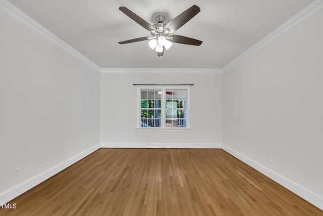5121 Ten Point Trl, Wake Forest, NC 27587 - spare room with crown molding, wood finished floors, baseboards, and ceiling fan