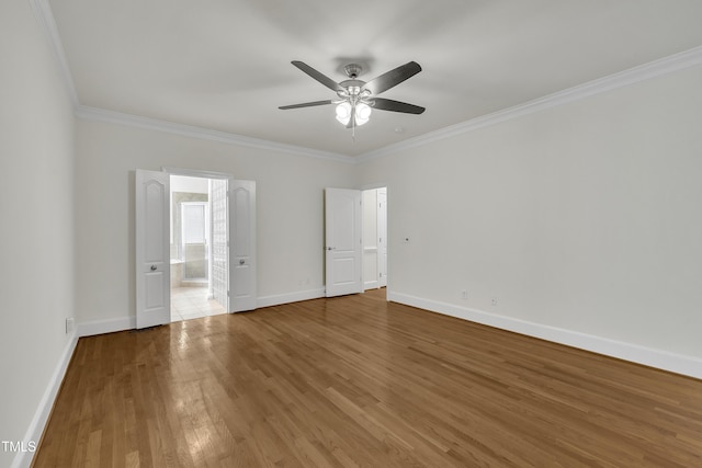5121 Ten Point Trl, Wake Forest, NC 27587 - unfurnished bedroom featuring ornamental molding, baseboards, wood finished floors, ensuite bath, and ceiling fan