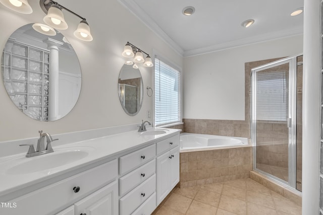 5121 Ten Point Trl, Wake Forest, NC 27587 - full bathroom featuring a garden tub, double vanity, tile patterned floors, crown molding, and a tile shower
