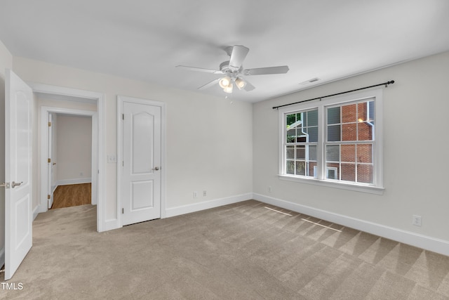5121 Ten Point Trl, Wake Forest, NC 27587 - unfurnished bedroom with carpet flooring, baseboards, and ceiling fan