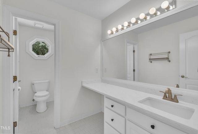 5121 Ten Point Trl, Wake Forest, NC 27587 - bathroom featuring tile patterned floors, toilet, vanity, and baseboards