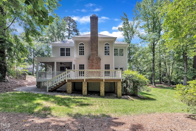 5121 Ten Point Trl, Wake Forest, NC 27587 - rear view of house featuring ceiling fan, stairway, a wooden deck, a chimney, and brick siding