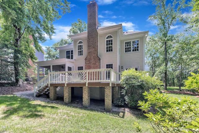 5121 Ten Point Trl, Wake Forest, NC 27587 - rear view of property with stairway, a ceiling fan, a wooden deck, a chimney, and a lawn