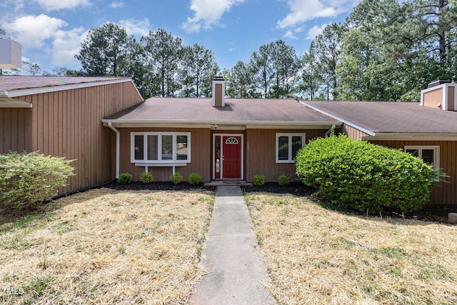 139 Hollyhock Ct, Durham, NC 27713 - view of front of property featuring a chimney and a front lawn