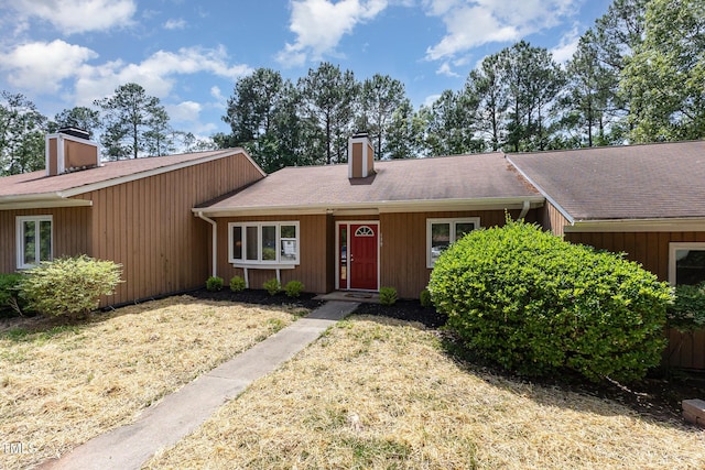 139 Hollyhock Ct, Durham, NC 27713 - view of front of house featuring a chimney and a shingled roof