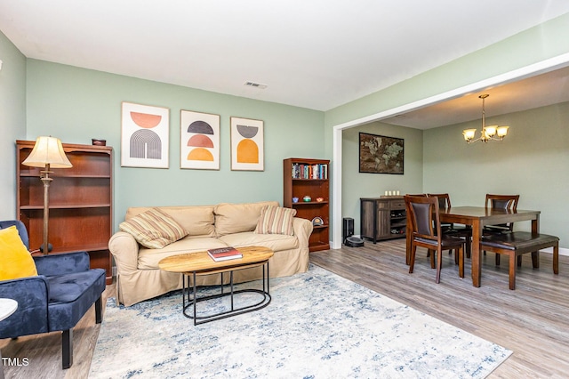 139 Hollyhock Ct, Durham, NC 27713 - living room with a chandelier and wood finished floors