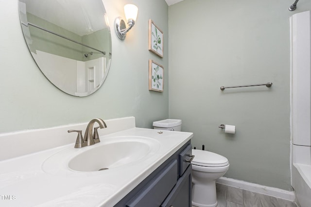 139 Hollyhock Ct, Durham, NC 27713 - bathroom featuring toilet, vanity, and baseboards
