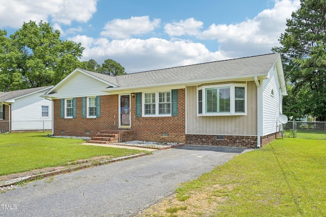 102 Pine St, Dunn, NC 28334 - single story home with crawl space, driveway, and a shingled roof