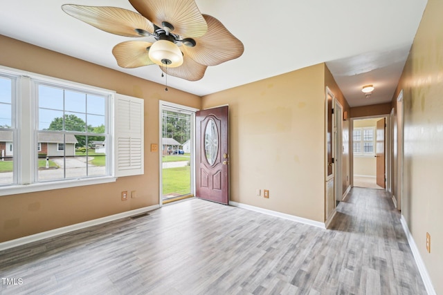 102 Pine St, Dunn, NC 28334 - foyer featuring wood finished floors, plenty of natural light, baseboards, and ceiling fan