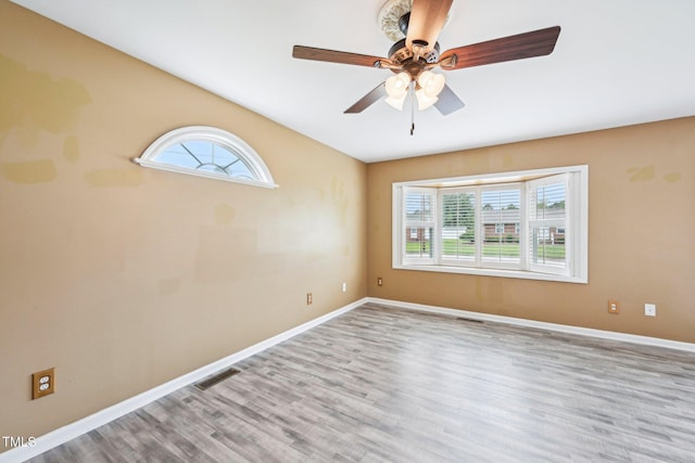 102 Pine St, Dunn, NC 28334 - unfurnished room with healthy amount of natural light, wood finished floors, and baseboards