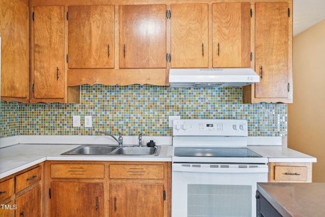 102 Pine St, Dunn, NC 28334 - kitchen with electric range, under cabinet range hood, a sink, light countertops, and decorative backsplash