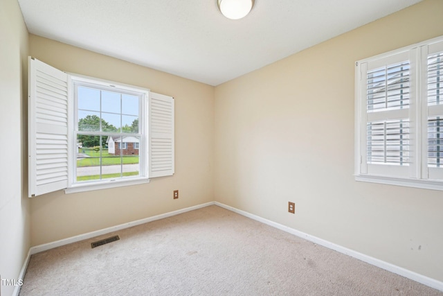 102 Pine St, Dunn, NC 28334 - carpeted empty room with baseboards