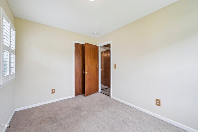 102 Pine St, Dunn, NC 28334 - unfurnished bedroom with carpet flooring and baseboards