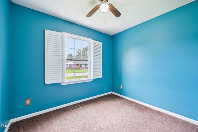 102 Pine St, Dunn, NC 28334 - carpeted empty room featuring a ceiling fan, a textured ceiling, and baseboards