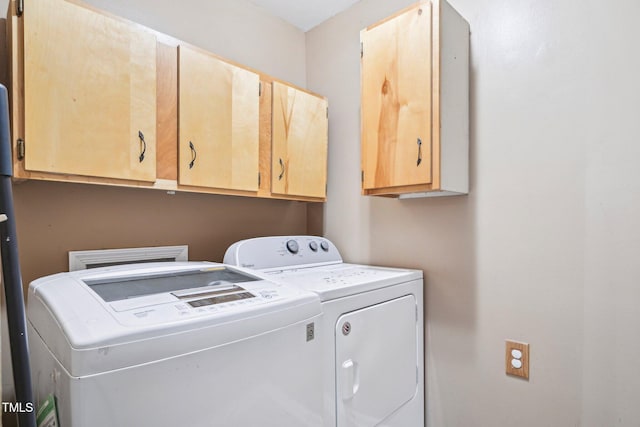 102 Pine St, Dunn, NC 28334 - washroom with cabinet space and washer and dryer
