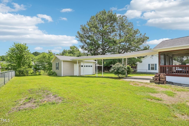 102 Pine St, Dunn, NC 28334 - view of yard with an outbuilding and a carport