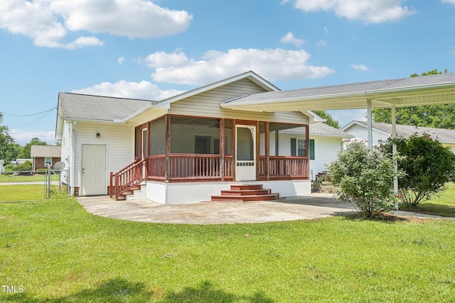 102 Pine St, Dunn, NC 28334 - view of front of home with a shingled roof and a sunroom