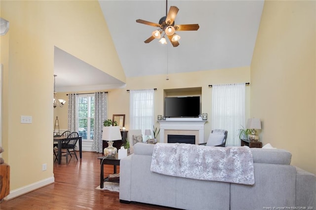 15 London Way, Spring Lake, NC 28390 - living area with ceiling fan, high vaulted ceiling, wood finished floors, a fireplace, and a chandelier