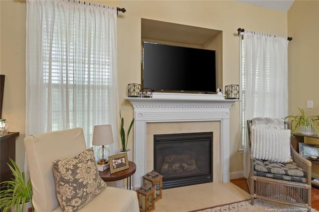 15 London Way, Spring Lake, NC 28390 - sitting room featuring a fireplace with flush hearth and wood finished floors