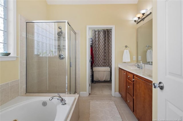 15 London Way, Spring Lake, NC 28390 - bathroom featuring a stall shower, a whirlpool tub, double vanity, and tile patterned floors