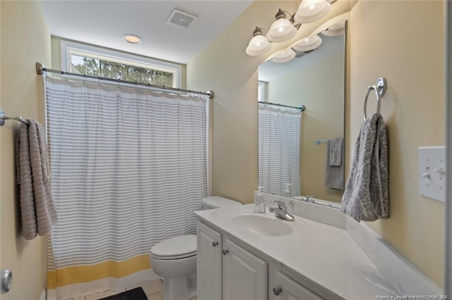 15 London Way, Spring Lake, NC 28390 - full bathroom featuring vanity, toilet, tile patterned floors, and a shower with shower curtain
