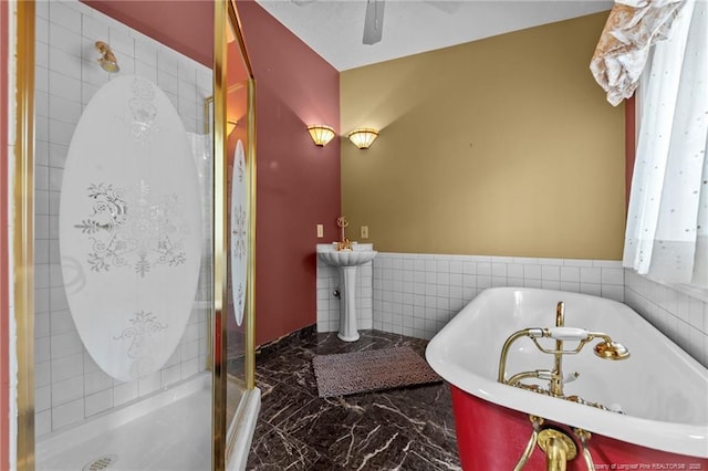 114 Birch Cir, Raeford, NC 28376 - full bathroom with marble tiled floors, a shower stall, ceiling fan, and a soaking tub