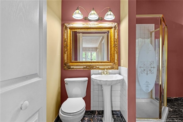 114 Birch Cir, Raeford, NC 28376 - full bathroom featuring a shower stall, marble look tile flooring, and toilet