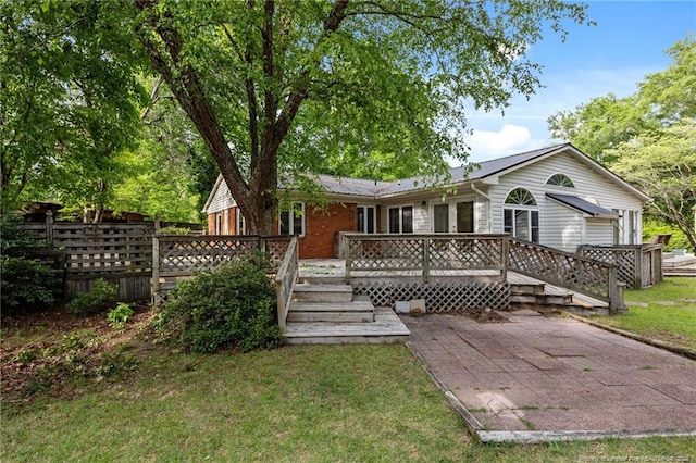 114 Birch Cir, Raeford, NC 28376 - rear view of house with a deck and a patio
