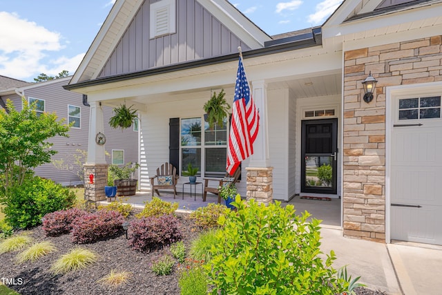40 Bourne Dr, Franklinton, NC 27525 - entrance to property featuring a porch, board and batten siding, and stone siding