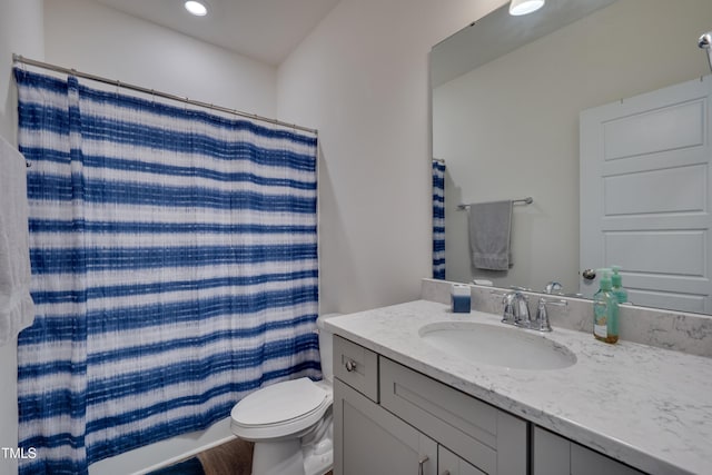 40 Bourne Dr, Franklinton, NC 27525 - full bathroom featuring vanity, toilet, recessed lighting, wood finished floors, and shower / bathtub combination with curtain