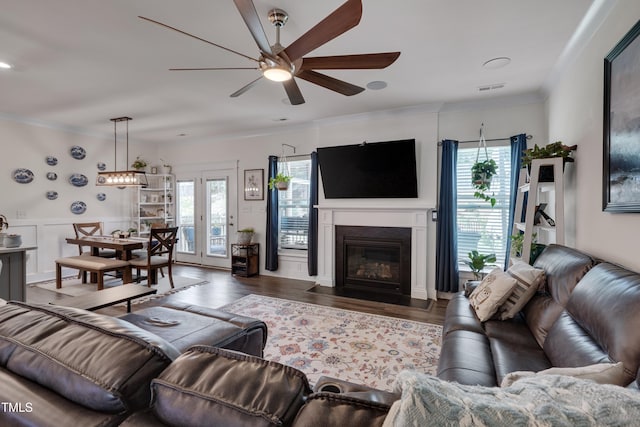 40 Bourne Dr, Franklinton, NC 27525 - living room with ceiling fan, crown molding, wood finished floors, and a fireplace with flush hearth