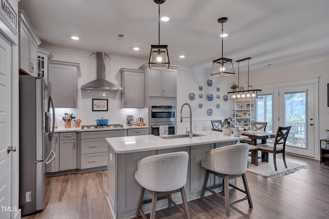 40 Bourne Dr, Franklinton, NC 27525 - kitchen with stainless steel appliances, gray cabinetry, wall chimney exhaust hood, a sink, and light countertops