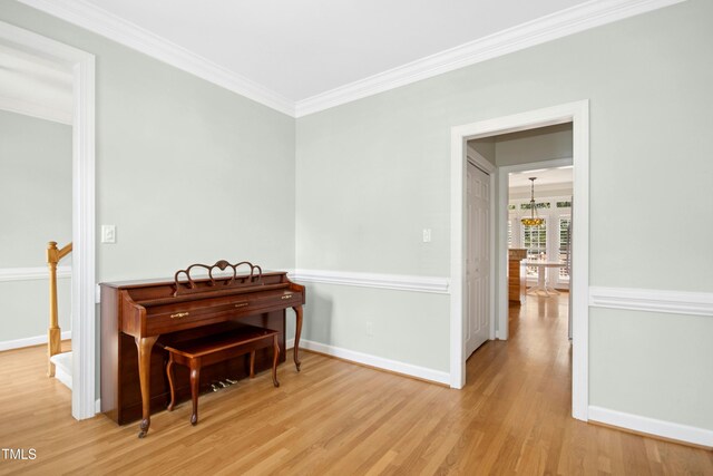 1003 Blackberry Ln, Durham, NC 27712 - living area featuring wood finished floors and crown molding