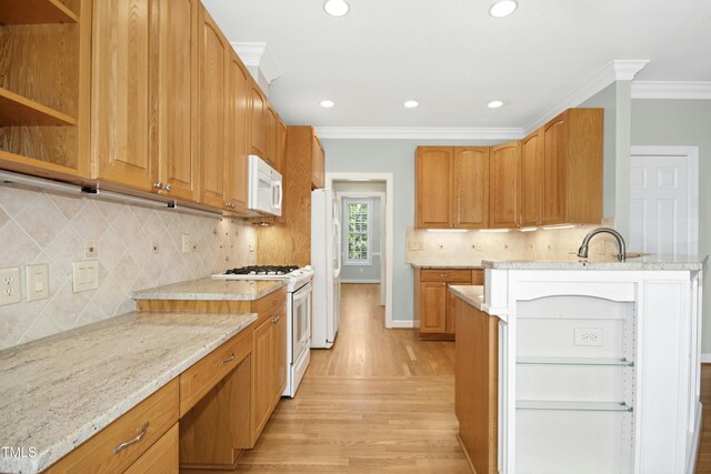 1003 Blackberry Ln, Durham, NC 27712 - kitchen with white appliances, crown molding, light wood-style flooring, light stone counters, and recessed lighting