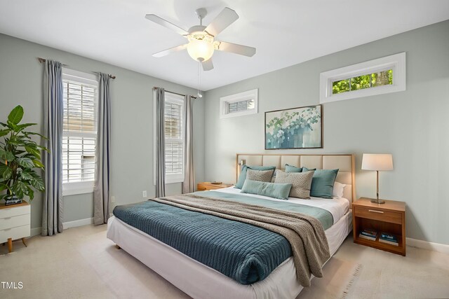 1003 Blackberry Ln, Durham, NC 27712 - bedroom with carpet floors, multiple windows, and a ceiling fan