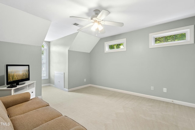 1003 Blackberry Ln, Durham, NC 27712 - living area featuring light carpet, a ceiling fan, and vaulted ceiling