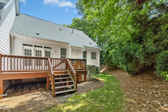 1003 Blackberry Ln, Durham, NC 27712 - rear view of house with a shingled roof, a wooden deck, and stairway