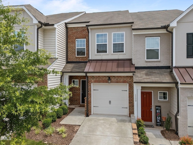 1107 Beyer Pl, Durham, NC 27703 - multi unit property with brick siding, a standing seam roof, an attached garage, and driveway