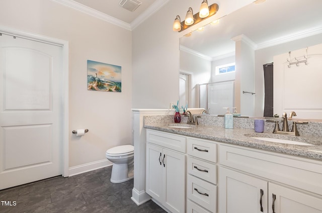 1828 Wellspring Ct, Graham, NC 27253 - bathroom with crown molding, double vanity, toilet, a shower with shower door, and baseboards