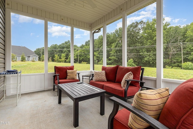 1828 Wellspring Ct, Graham, NC 27253 - sunroom featuring a ceiling fan, outdoor lounge area, healthy amount of natural light, and view of wooded area