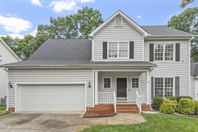 8912 Erinsbrook Dr, Raleigh, NC 27617 - traditional-style home featuring driveway, an attached garage, covered porch, and roof with shingles