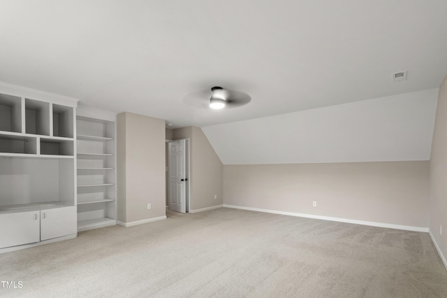 8912 Erinsbrook Dr, Raleigh, NC 27617 - additional living space featuring light carpet, baseboards, and lofted ceiling