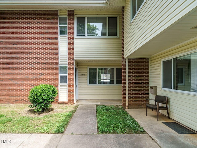 2316 Champion Ct, Raleigh, NC 27606 - view of exterior entry featuring brick siding